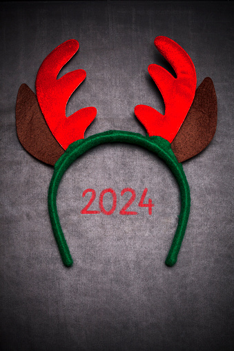 Santa reindeer horns with 2024, on blackboard