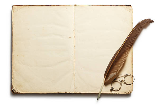 istock Quill and eyeglasses on old open antique book 171341031