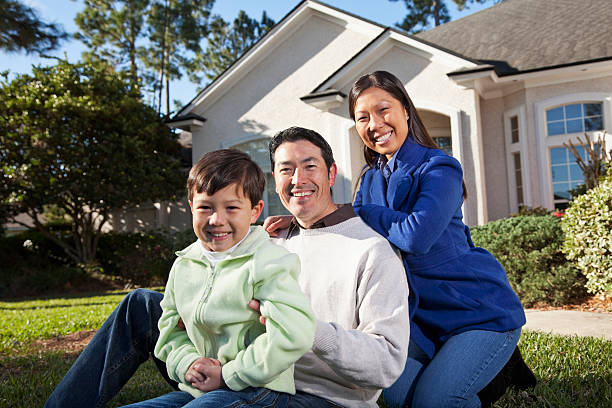 istock Family in front of house 171341085