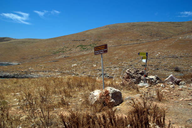 view of the arid landscape and the sign - mani peninsula imagens e fotografias de stock