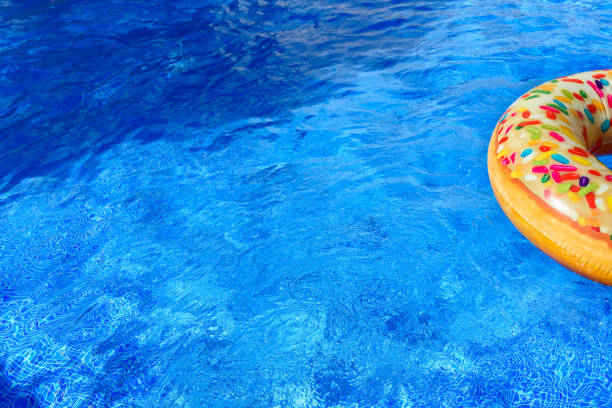 istock Detail with copy space of a round float in a pool with clean and refreshing waters, background with negative space for summer. 1713420802