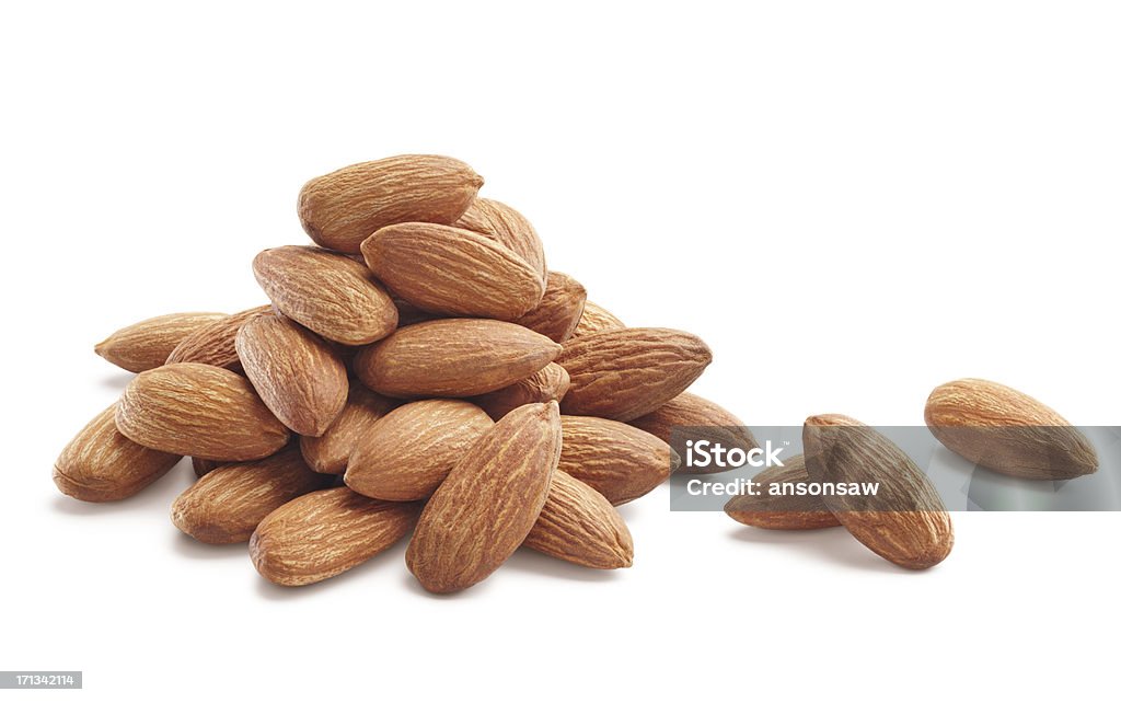 almonds heap of almonds isolated on white background Almond Stock Photo