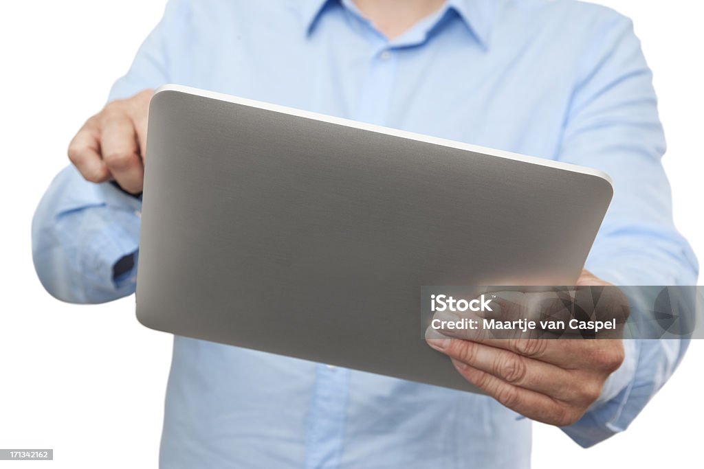 Businessman Using Digital Tablet PC; Seen From the Back Close-up Of Businessman Using Digital Tablet PC Adult Stock Photo