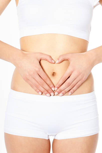 istock Woman's hands forming heart symbol on belly 171342270