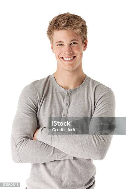 Attractive Happy Man Standing With His Arms Crossed Stock Photo - Download Image Now