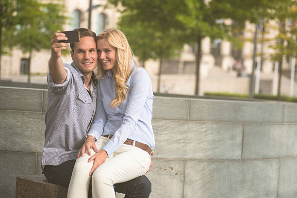 istock Cheerful young couple looking at smart phone 171342545