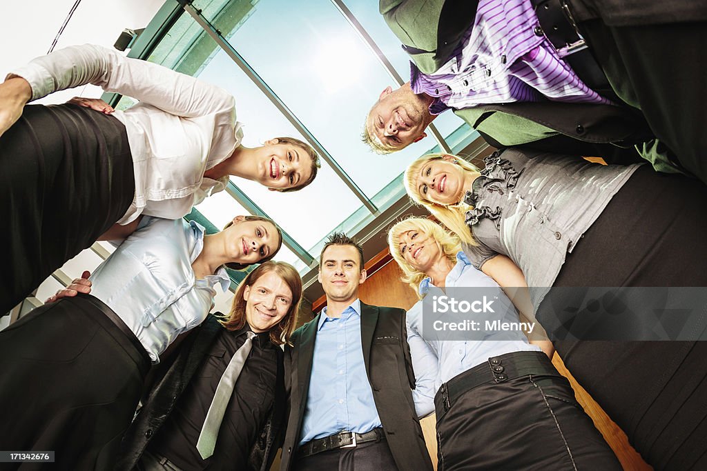 Business Team Together in Circle "Mixed Business Team standing in a circle, side by side." Active Seniors Stock Photo