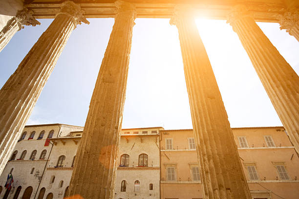Temple of Minerva in Assisi, Umbria, Italy The columns of the Temple of Minerva in Assisi. Umbria, Italy. umbria architecture assisi corinthian stock pictures, royalty-free photos & images