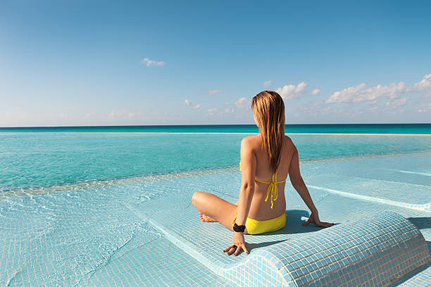 istock On Vacation Sunbathing and Relaxing in Infinity Pool Hz 171342799