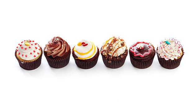 istock Fancy Gourmet Cupcakes, Dessert Temptations in Row on White Backround 171343030