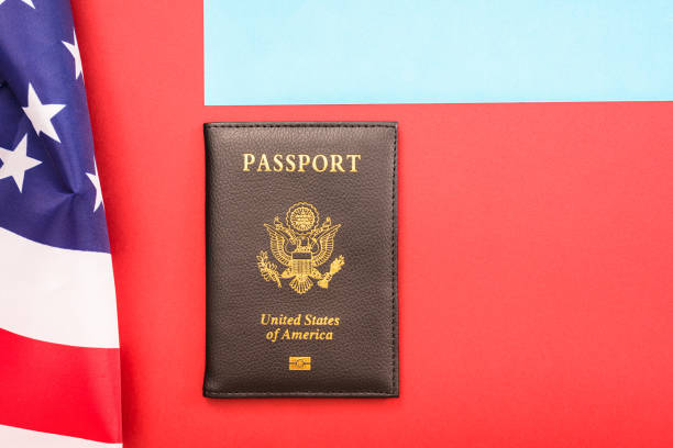 istock American passport next to a patriotic flag. 1713431673