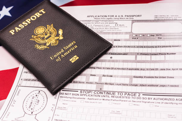 istock Application form to get a new American passport, patriotic flag background. 1713431714