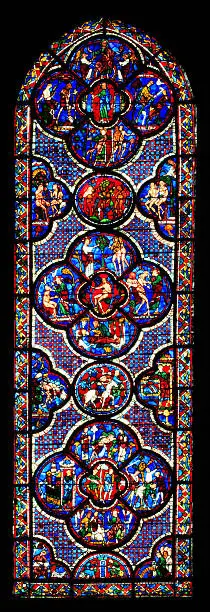 Stained glass window Parable of the Good Samaritan of the cathedral Notre Dame, Chartres. This window is one of the row lower windows at the south aisle of the church.The window is made in the 13 th century