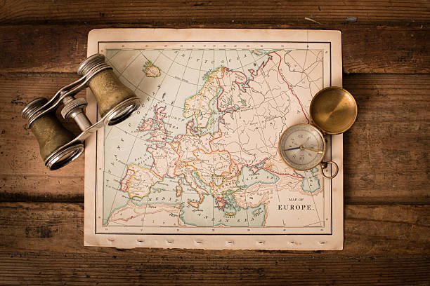 istock Antique 1870 Map of Europe, Binoculars, and Compass on Trunk 171343646