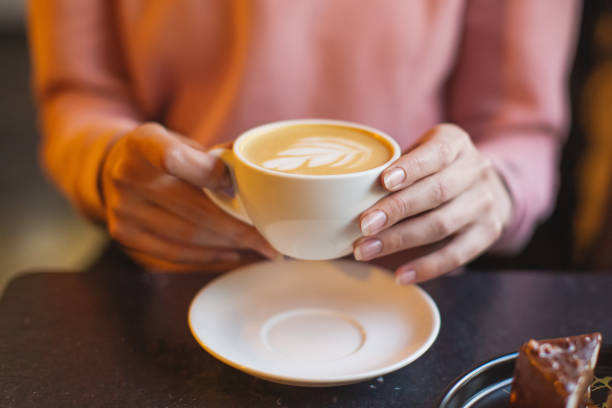 istock Cup of coffee in hands 1713439293
