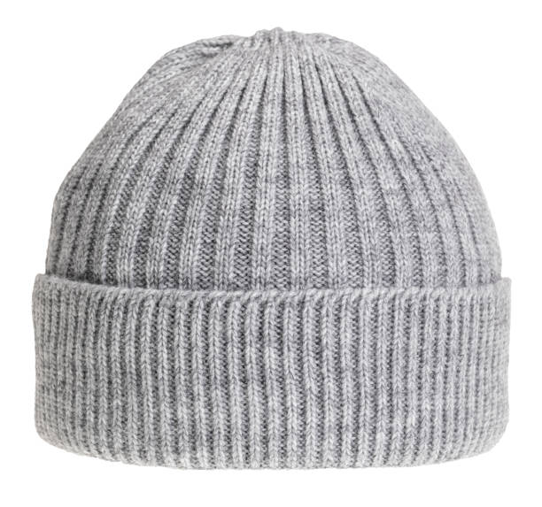 Grey knit winter bobble hat isolated on white stock photo