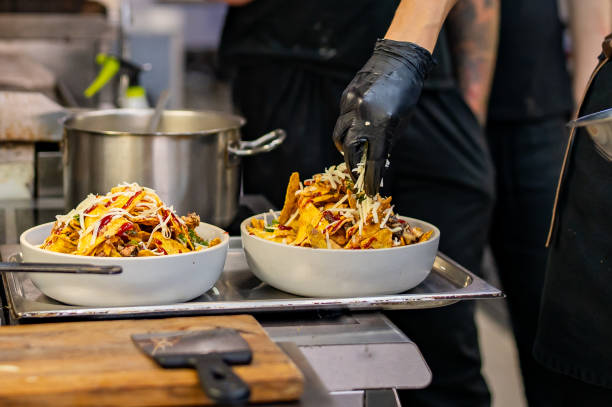 istock chef Cooking of crispy corn chips nachos at the restaurant kitchen 1713456680