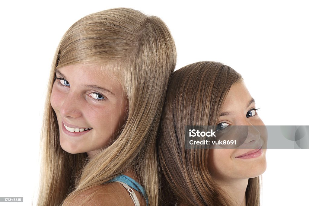 Cute girls Two teenage girls in front of white background Teenager Stock Photo