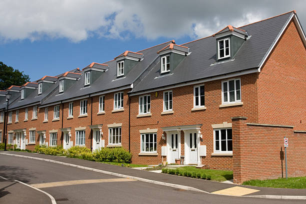 Terraced houses in England A row of terraced houses in England. exeter england stock pictures, royalty-free photos & images