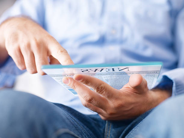istock man reading news on the futuristic digital tablet 171346068