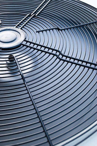 Air Conditioner (shallow DOF) HVAC unit - fan is motion blured. chiller hvac equipment photos stock pictures, royalty-free photos & images