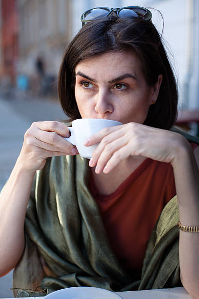 istock beautiful woman in a cafe 171346351