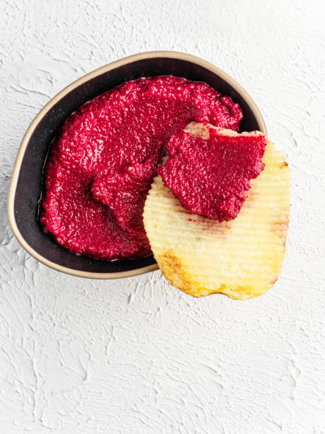 Red beet dip with potato chips. Beet dipping Sauce. Beet dipping sauce and nacho Chip