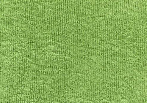 Texture of light green and mint color background from woven textile material with wicker pattern, macro. Structure of vintage olive fabric cloth, narrow backdrop.