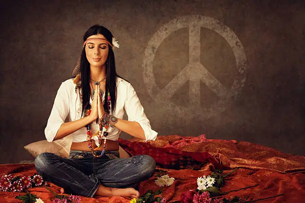 young hippie woman praying for world peace