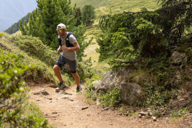 istock Trail runner bounds along mountain trail 1713477908