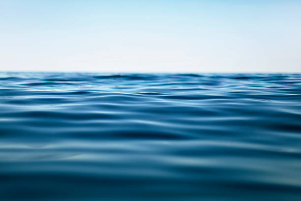 поверхность воды - flowing blue rippled environment стоковые фото и изображения