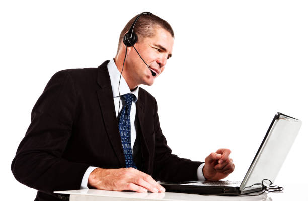 istock Handsome smiling businessman busy with headset and laptop 171347853