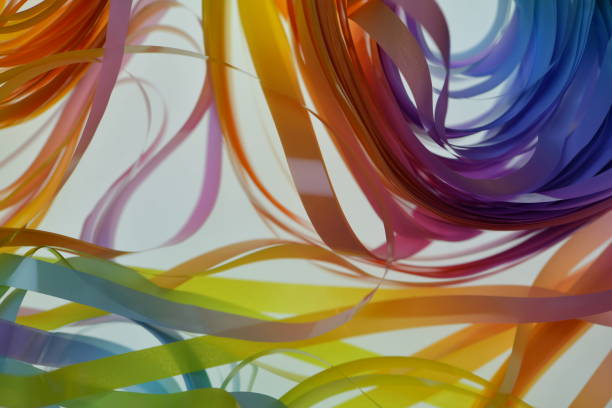 Pastel colored ribbons on white background