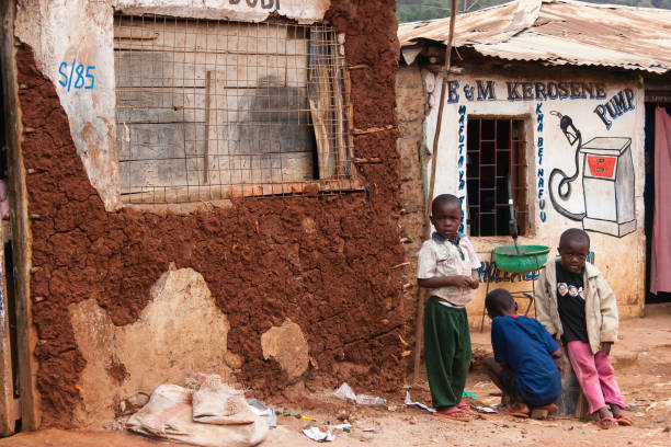 Boys Selling Petrol in an African Slum stock photo