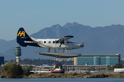 Richmond, Canada - 15th September 2023: C-FHAD, a 1956 De Havilland Canada DHC-3T Otter seaplane, owned and operated by Harbour Air, coming in over the Fraser River to land at Vancouver Airport South in Richmond, British Columbia.