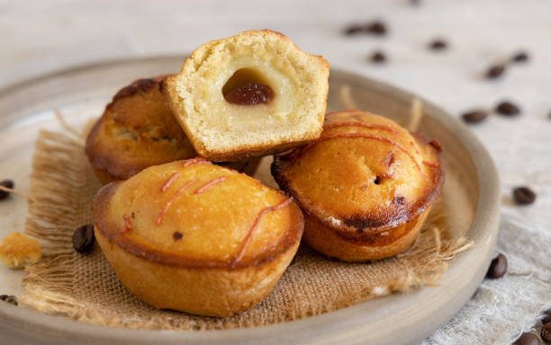 istock Pasticciotto leccese pastry filled with egg custard cream and sour cherry jam on a plate close up 1713482911