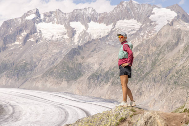 istock Female trail runner takes a break above glacier 1713483601