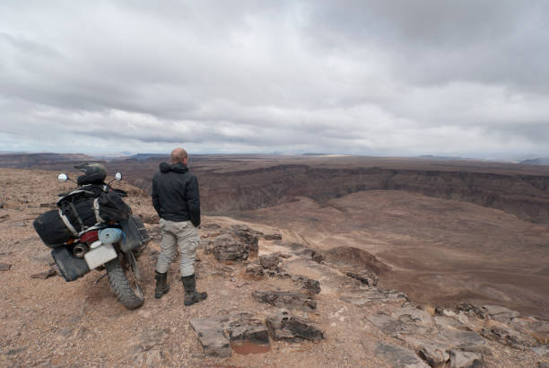 istock adventure biker appreciates fish river canyon 171348888