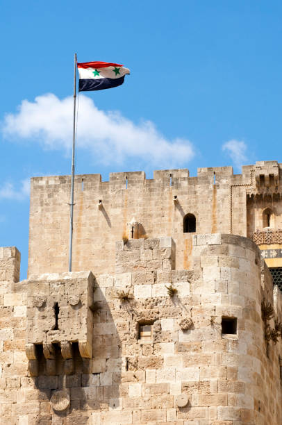 istock Aleppo Citadel and Syrian flag 171349033