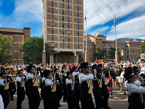 Boulder, Colorado, USA- September 30, 2023: University of Colorado Marching Band parading toward the stadium for a football game.
