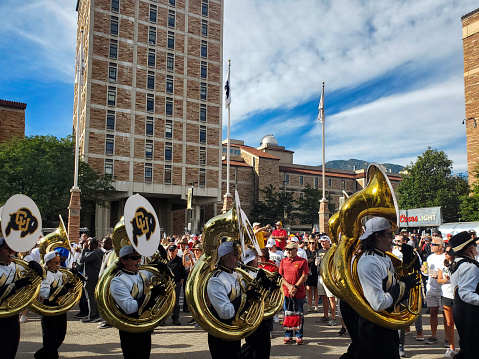 Boulder, Colorado, USA- September 30, 2023: University of Colorado Marching Band parading toward the stadium for a football game.