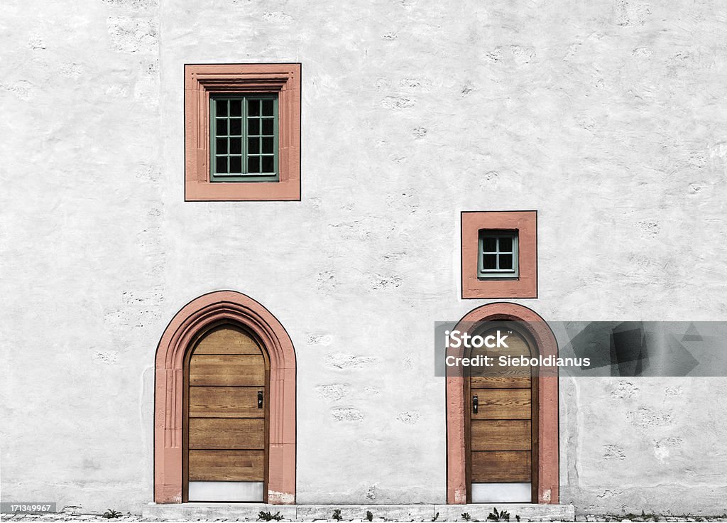 White Wall with doors and windows in Germany (historic plaster-facade). White Wall with doors and windows in Germany (historic plaster-facade).related: Gate Stock Photo