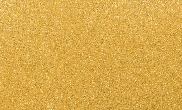 istock GOLDEN GLITTER sparkling background with bright reflections and many small lights 1713501046