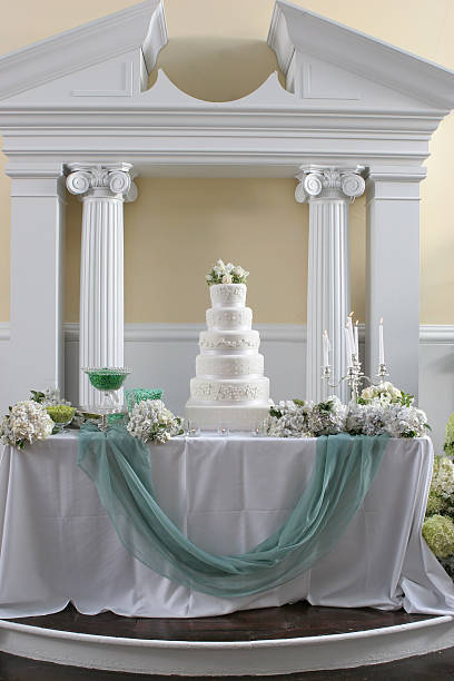 istock Ornate Decorative Large Tall Fancy Wedding Cake Centerpiece Cloth Drape 171350581