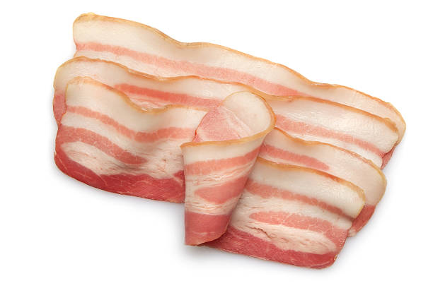 Bacon Slices of bacon on white background uncooked bacon stock pictures, royalty-free photos & images