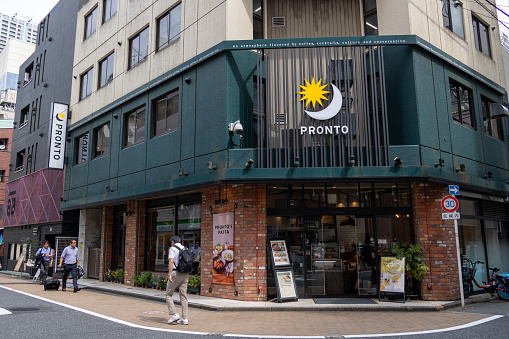 Tokyo, Japan - September 20, 2023 : Pedestrians walk past the Pronto cafe restaurant in Shinjuku, Tokyo, Japan.