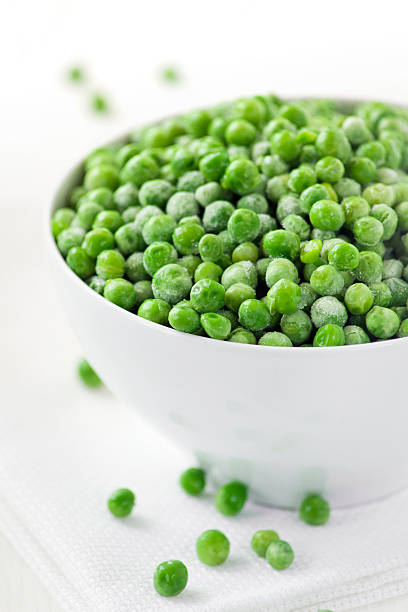 istock Frozen green peas in bowl 171351071