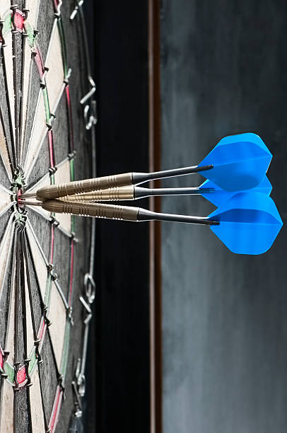 istock Dart board with three darts in the bulls eye 171351132