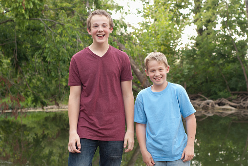 Two brothers enjoy a good natured laugh while having fun in the great outdoors.