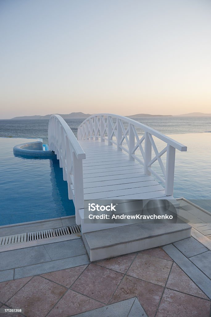 Greek paradise Swimming pool and the Aegean Sea Beach Stock Photo